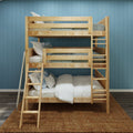 Natural wood twin-over-full bunk bed with ladder, white bedding and pillows on woven rug against blue paneled wall — space-saving kids' bedroom setup