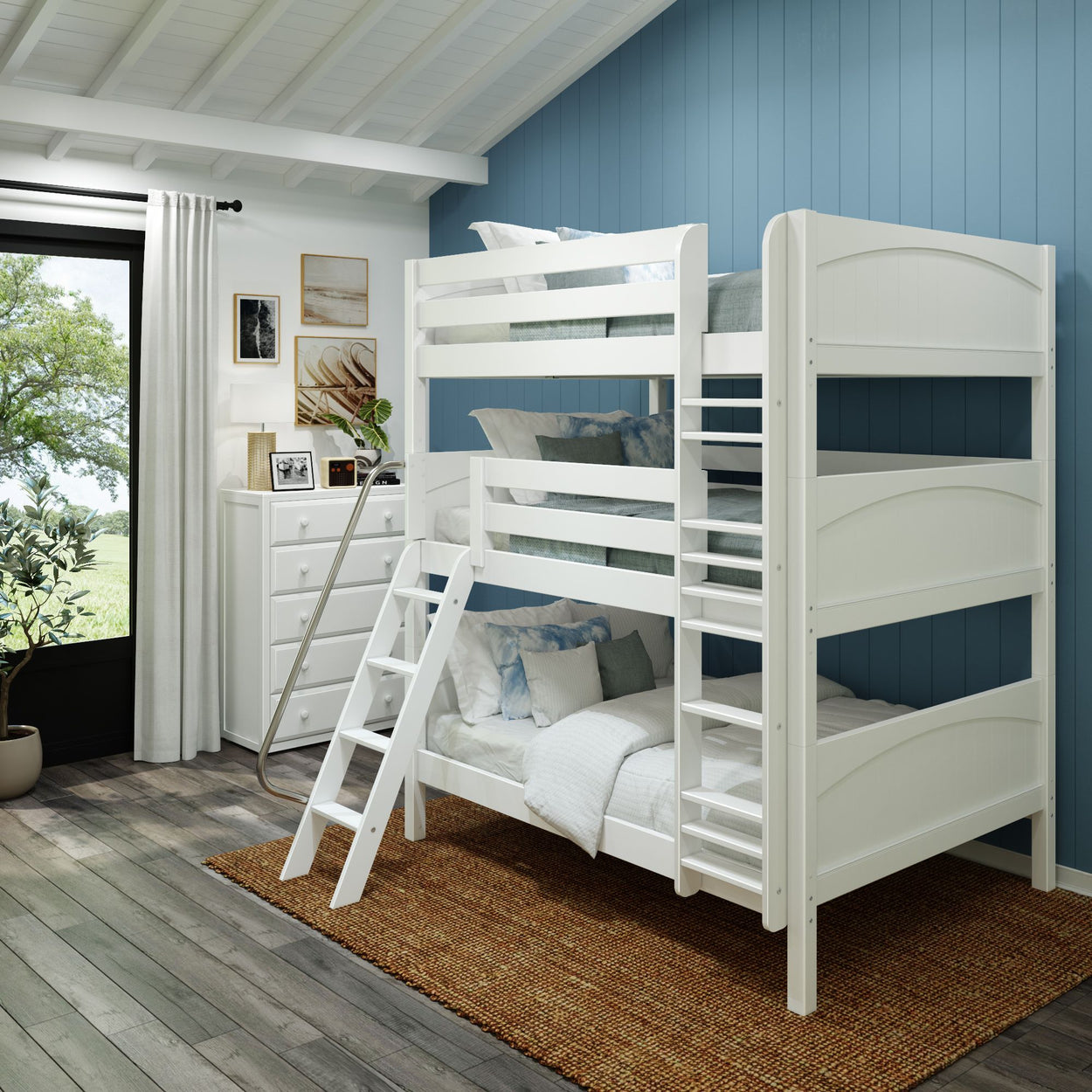 White bunk bed in a blue-themed bedroom with rustic decor and natural light.