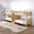 Wooden twin bunk beds in a bright neutral kids' bedroom with white bedding, boho area rug and built-in shelving