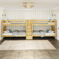 Natural wood twin-over-twin bunk beds with built-in storage drawers in a coastal farmhouse kids bedroom with shiplap walls, neutral bedding and pendant light