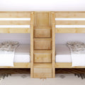 Natural wood bunk bed with central ladder and built-in storage drawers, twin mattresses with white linens in a kids bedroom