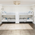 White wooden bunk beds with built-in storage, gray bedding and blue accent pillows in a neutral kids bedroom with shiplap walls and pendant light
