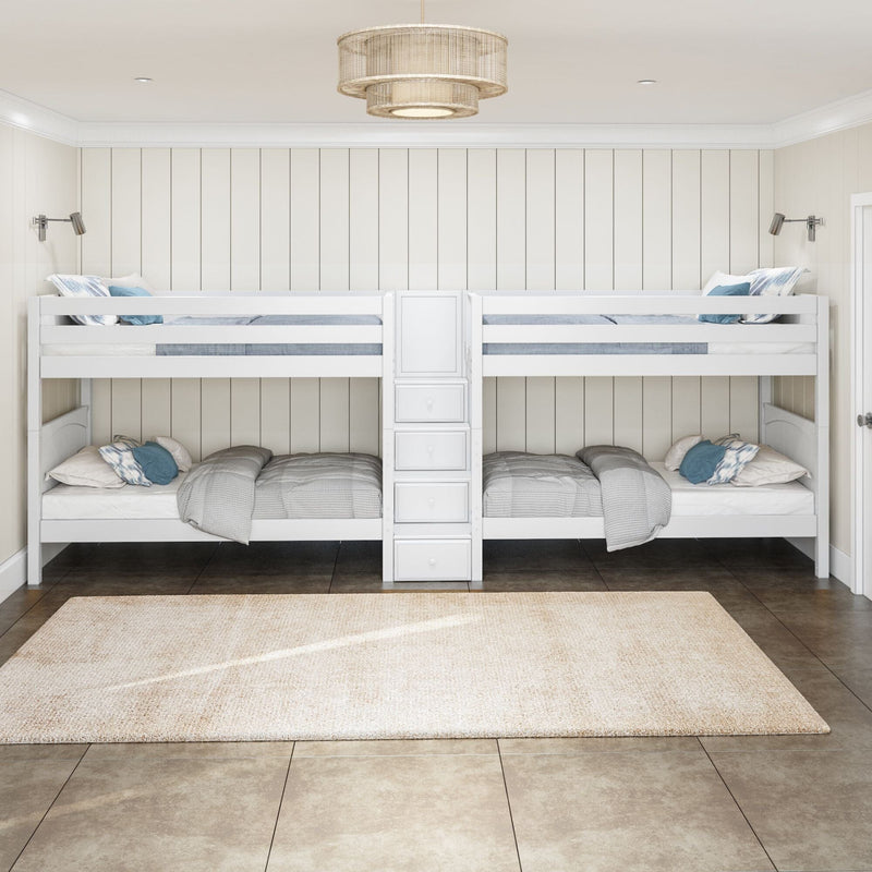 White wooden bunk beds with built-in storage, gray bedding and blue accent pillows in a neutral kids bedroom with shiplap walls and pendant light