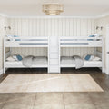 White twin bunk beds with center storage drawers, gray bedding and blue accent pillows in a neutral kids' bedroom with vertical shiplap walls, swing-arm reading lamps and rattan drum chandelier