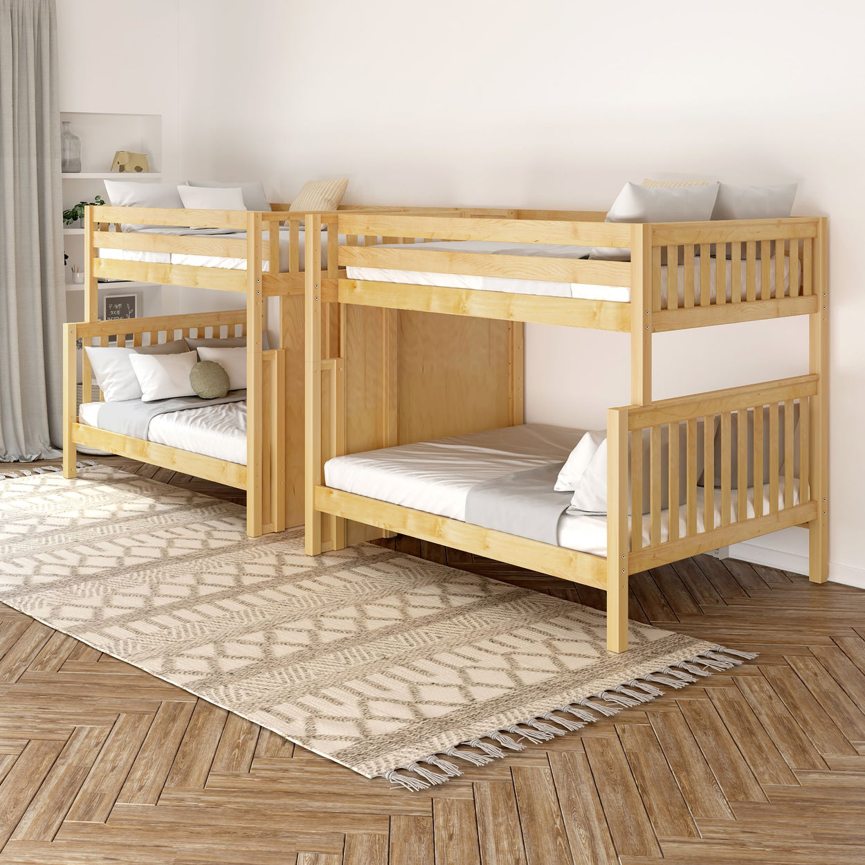 Natural wood bunk beds in a modern bedroom with geometric patterned rug.