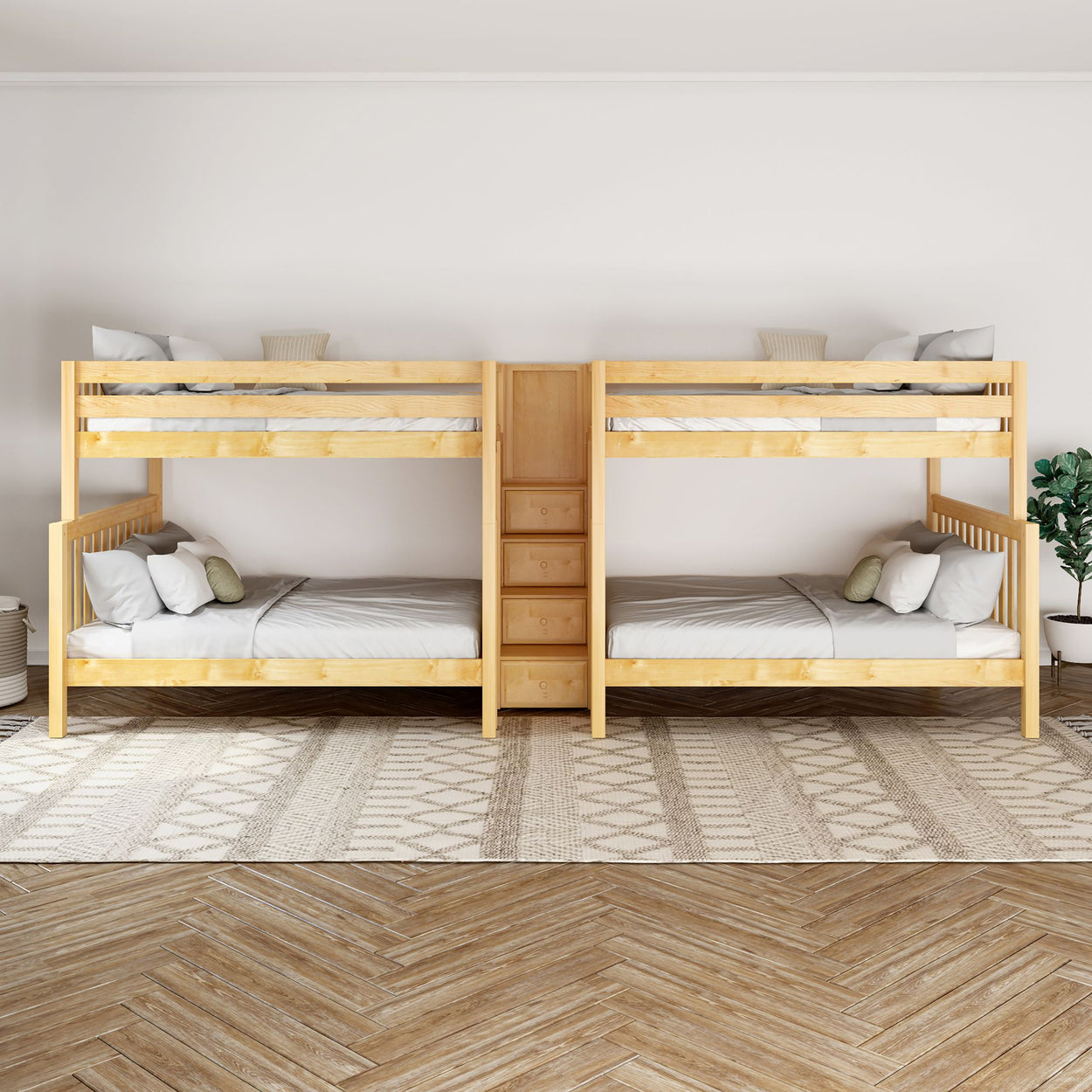 Wooden double bunk beds in a bright room with patterned rug and hardwood floor.