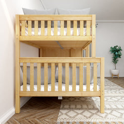 Wooden bunk bed in modern bedroom with cozy decor and indoor plant.