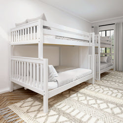 White wooden bunk beds in a bright bedroom with large window and patterned carpet.