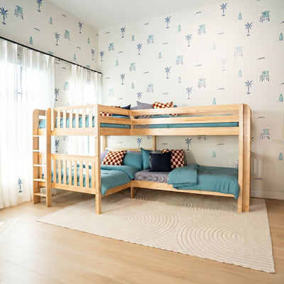 Coastal kids' bedroom with natural wood bunk beds, teal bedding, palm tree and surfboard wallpaper, sheer curtains and beige rug