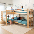 Three boys sitting on natural wood kids' bunk beds with teal bedding and surf-themed coastal wallpaper in a bright children's bedroom