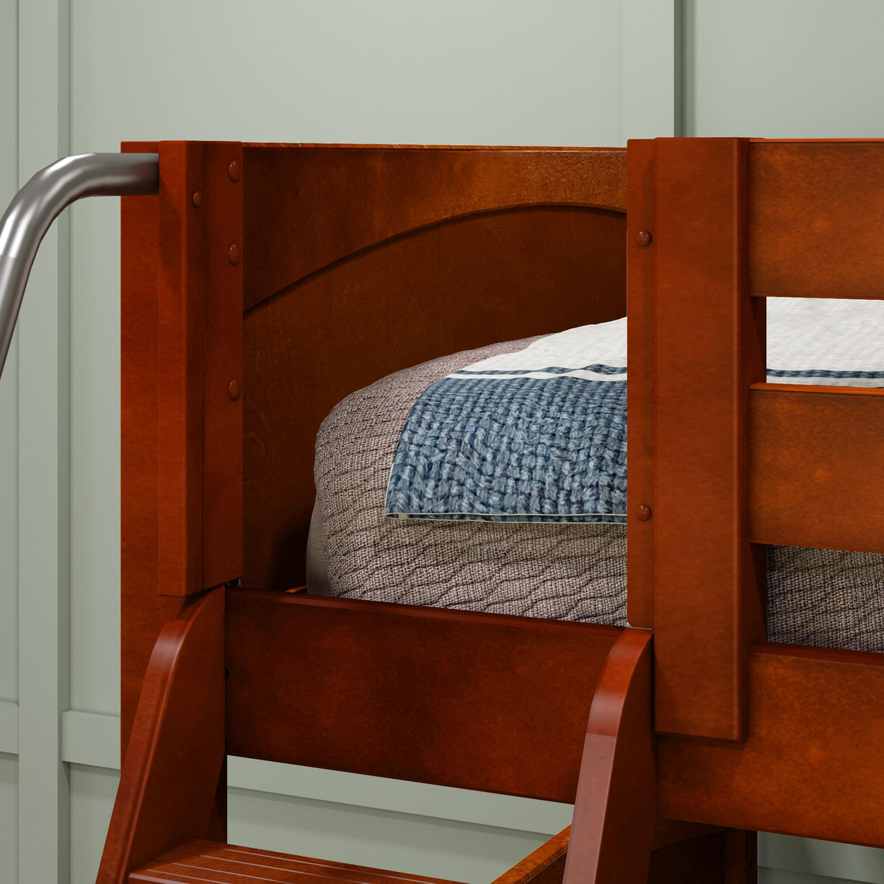 Wooden bunk bed with textured blanket and metal handrail in cozy bedroom setting.
