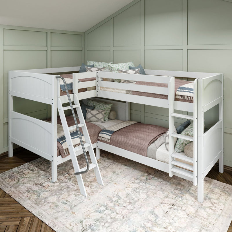 White wooden L-shaped bunk bed with ladder and twin mattresses, neutral quilts and decorative pillows in a kids' room with sage board-and-batten walls and patterned area rug on hardwood floor