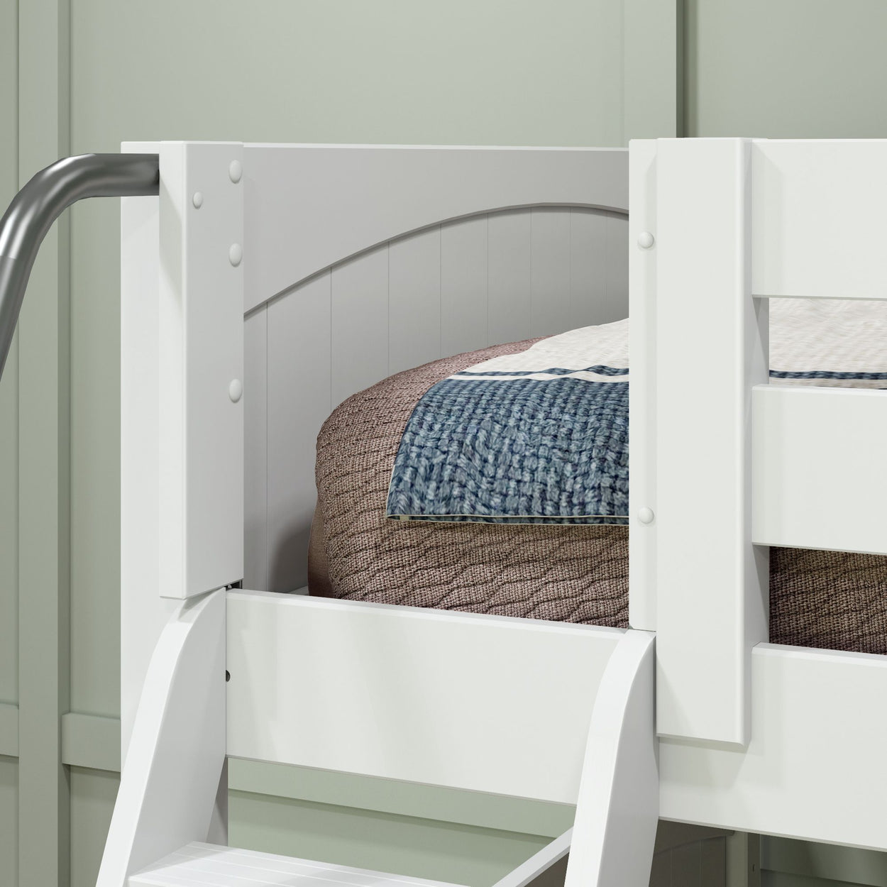 White bunk bed with a cozy quilted blanket, emphasizing modern bedroom furniture design.