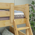 Natural pine wooden bunk bed ladder and safety rail on kids bunk bed with striped throw blanket