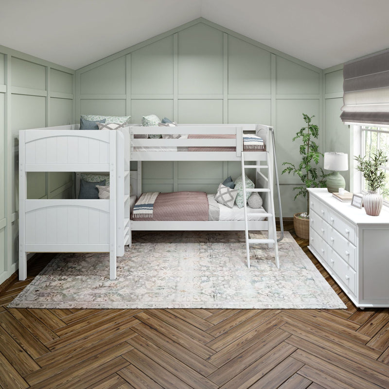 White twin over twin bunk bed with ladder in modern farmhouse kids bedroom featuring pastel green paneled walls white dresser patterned area rug herringbone hardwood floor indoor plants and natural window light