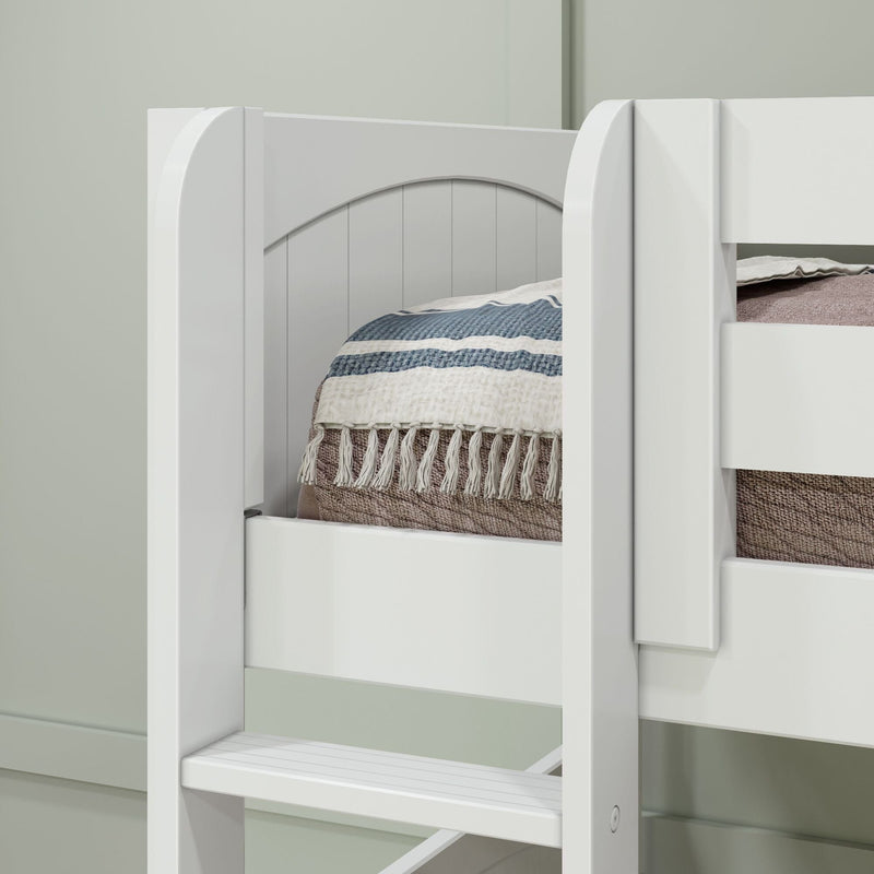 Close-up of a white wooden bunk bed ladder and safety rail with a striped fringed blanket on the top mattress in a modern kids' bedroom