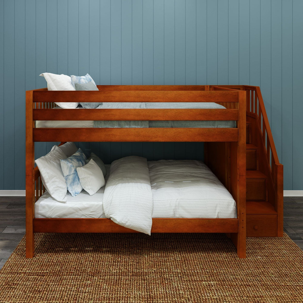 Wooden bunk bed with built-in staircase and storage drawers, white bedding and pillows against a blue paneled wall