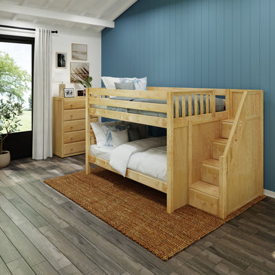Wooden bunk bed with stairs in a modern bedroom featuring blue accent wall and decorative elements.