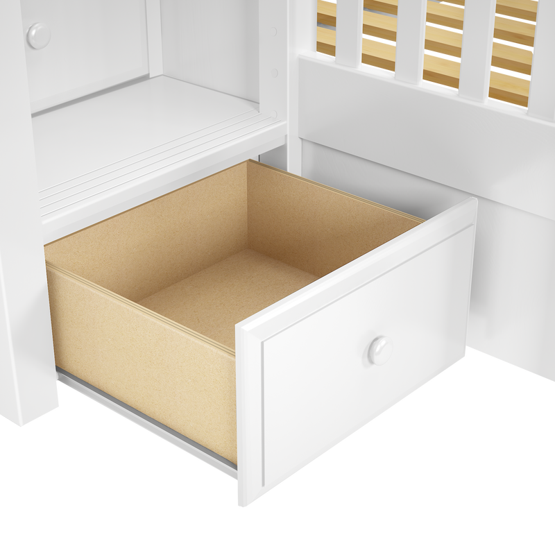 White wooden dresser with open drawer showing plywood interior, round knob and slatted side panel, storage furniture detail