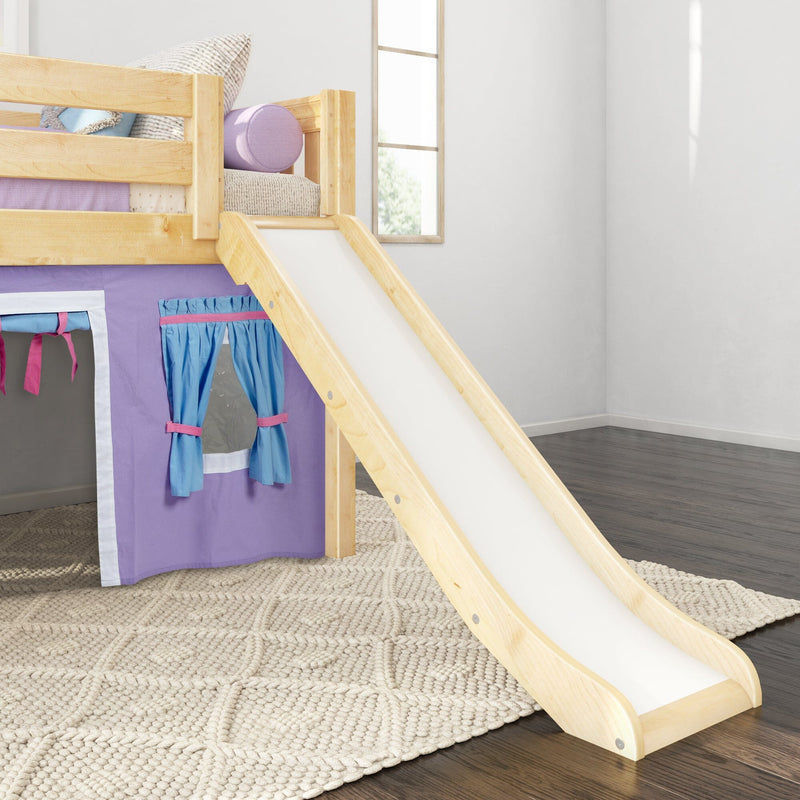 Wooden kids loft bed with white slide and purple play tent, blue curtains and pastel pillows in a modern children's bedroom