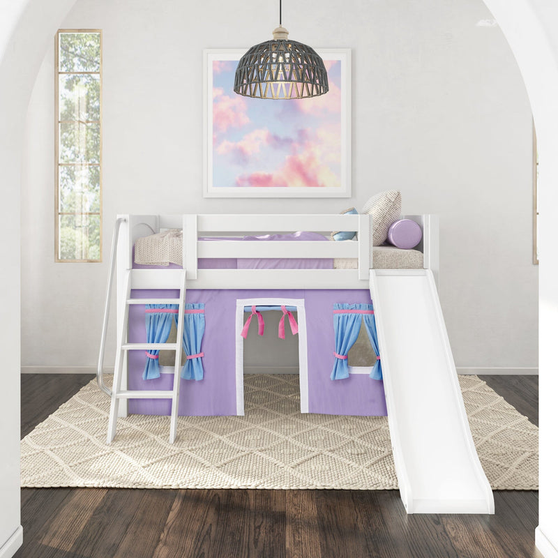 White wooden loft bed with slide and ladder, purple play-tent skirt and blue curtains, pastel cloud wall art and woven rattan pendant in a modern kids’ bedroom
