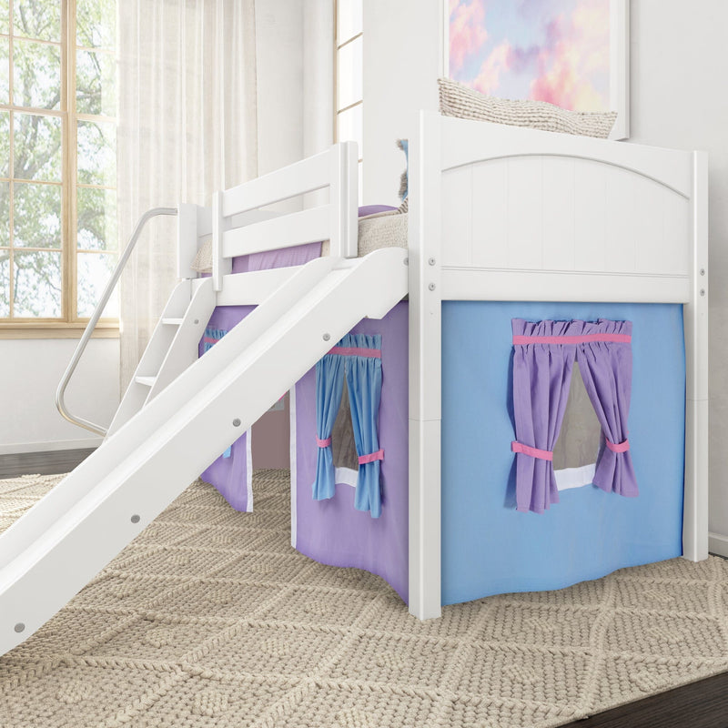 White wooden loft bunk bed with slide and purple-and-blue playhouse curtains, pastel cloud wall art, large wood-frame window with sheer curtains, and textured braided rug in a bright children's bedroom