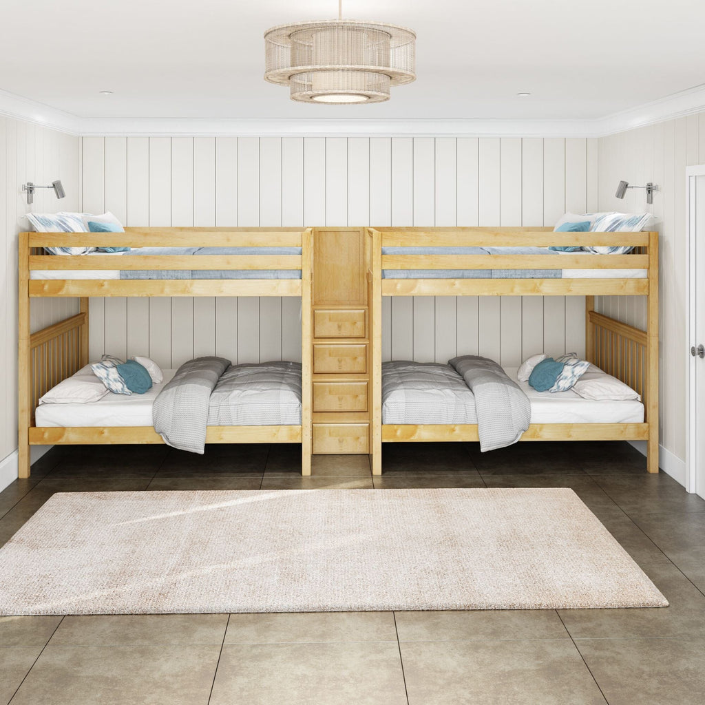 Light wood bunk beds in a shared kids' bedroom with white shiplap walls, blue accent pillows, overhead rattan chandelier and a neutral area rug