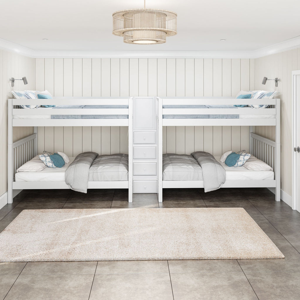 Bright kids' bedroom with white coastal-style bunk beds for four, central staircase with drawers, neutral rug and pendant light