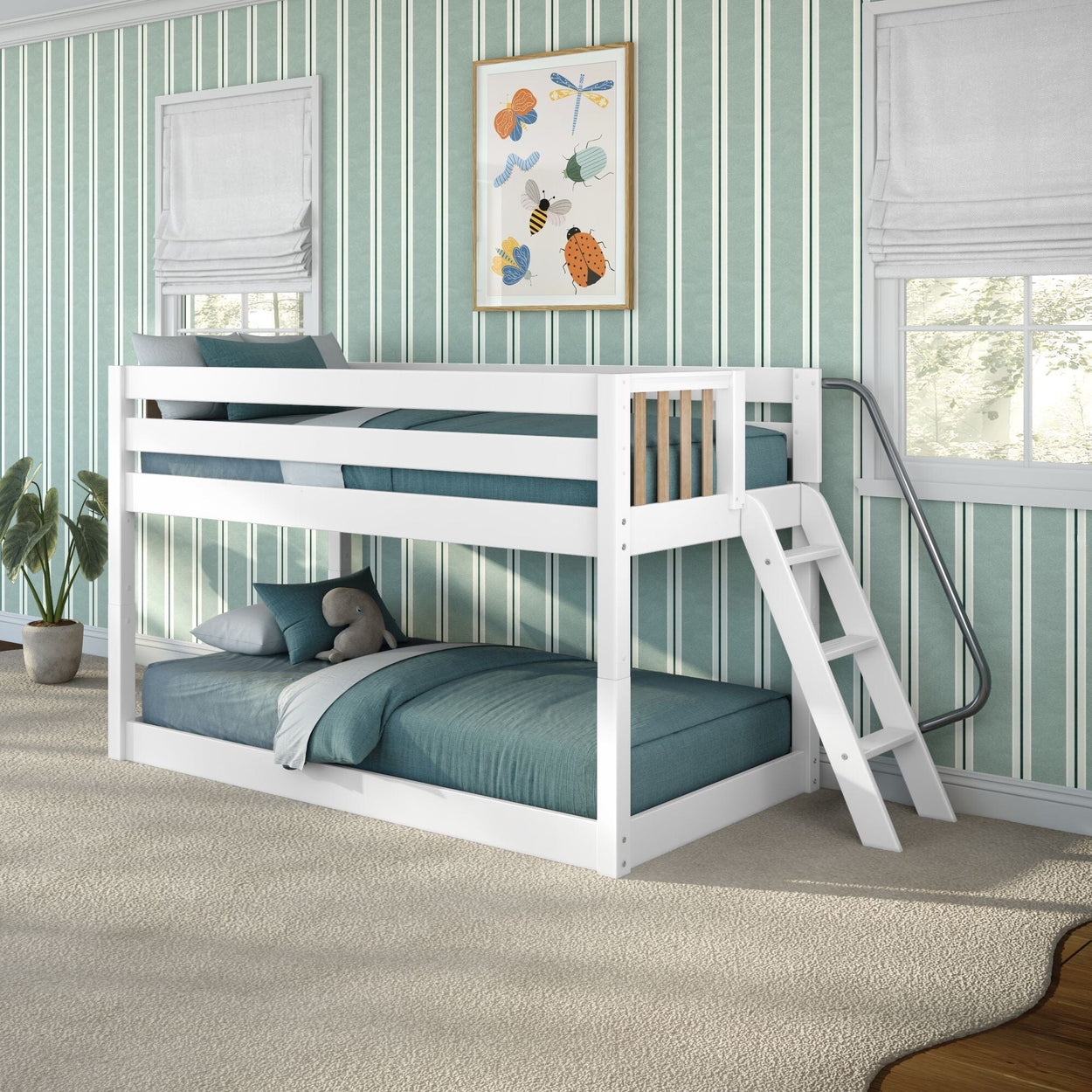 White wooden bunk bed with ladder and teal bedding in a children's bedroom with green striped wallpaper, framed bug artwork, potted plant and plush toy