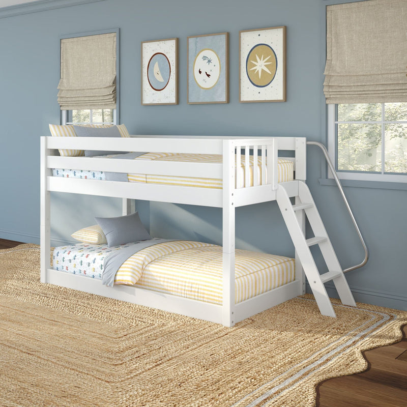 White bunk bed, blue children's bedroom, yellow-striped bedding, moon-and-star wall art, beige Roman shades, jute rug.