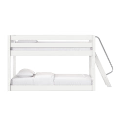 Minimal white wooden bunk bed with side ladder and white bedding — modern space-saving loft bed for kids' bedroom