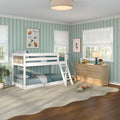 Children's bedroom with white wooden bunk bed, teal bedding, green striped wallpaper, natural wood dresser, roman shades and plush toys