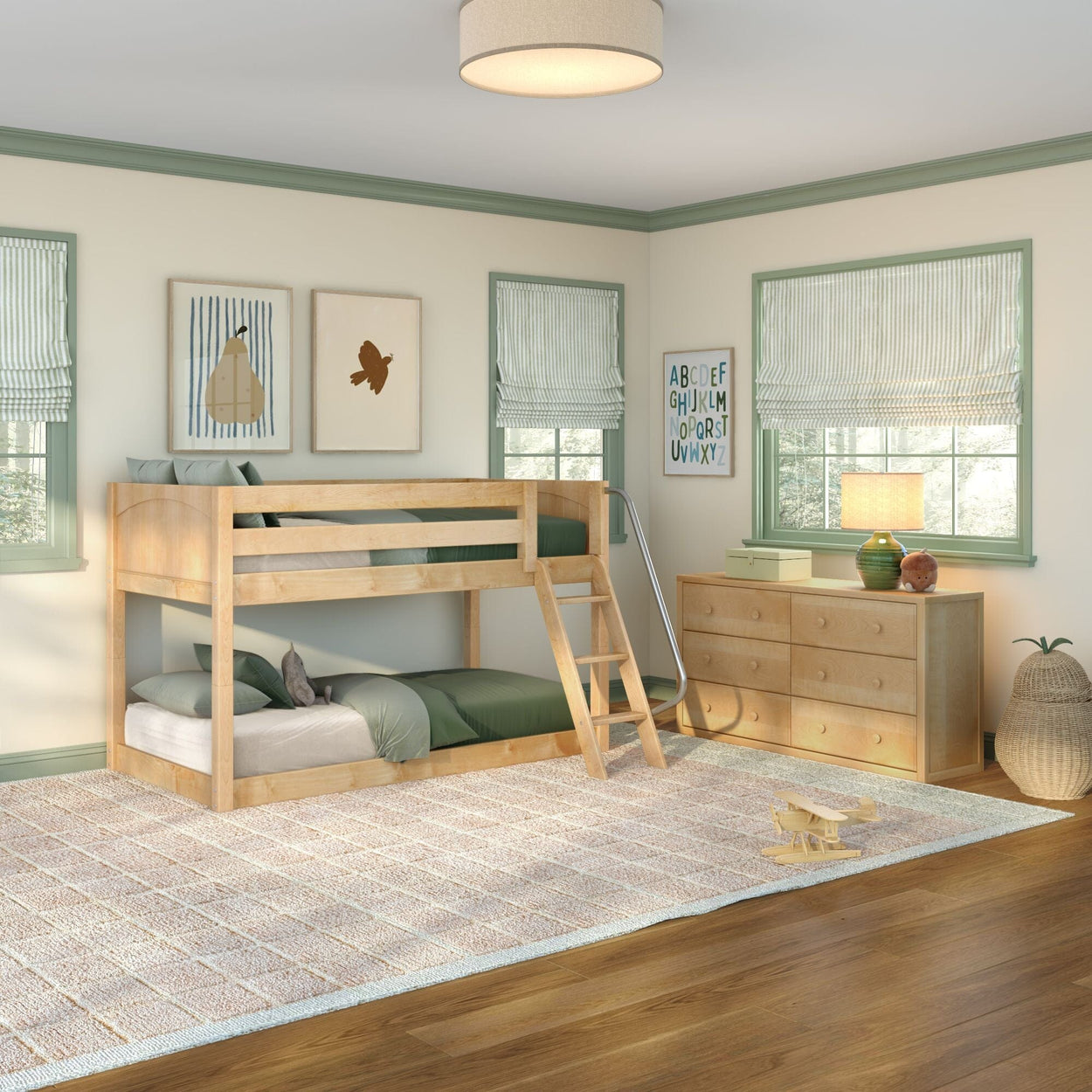 Bright children's bedroom featuring a natural wood bunk bed with ladder, green bedding, wooden dresser, alphabet wall art, striped Roman shades and large textured rug on hardwood floor — modern kids' room décor