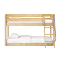 Light natural wood twin-over-full bunk bed with ladder and safety guardrail, white bedding, space-saving bedroom furniture