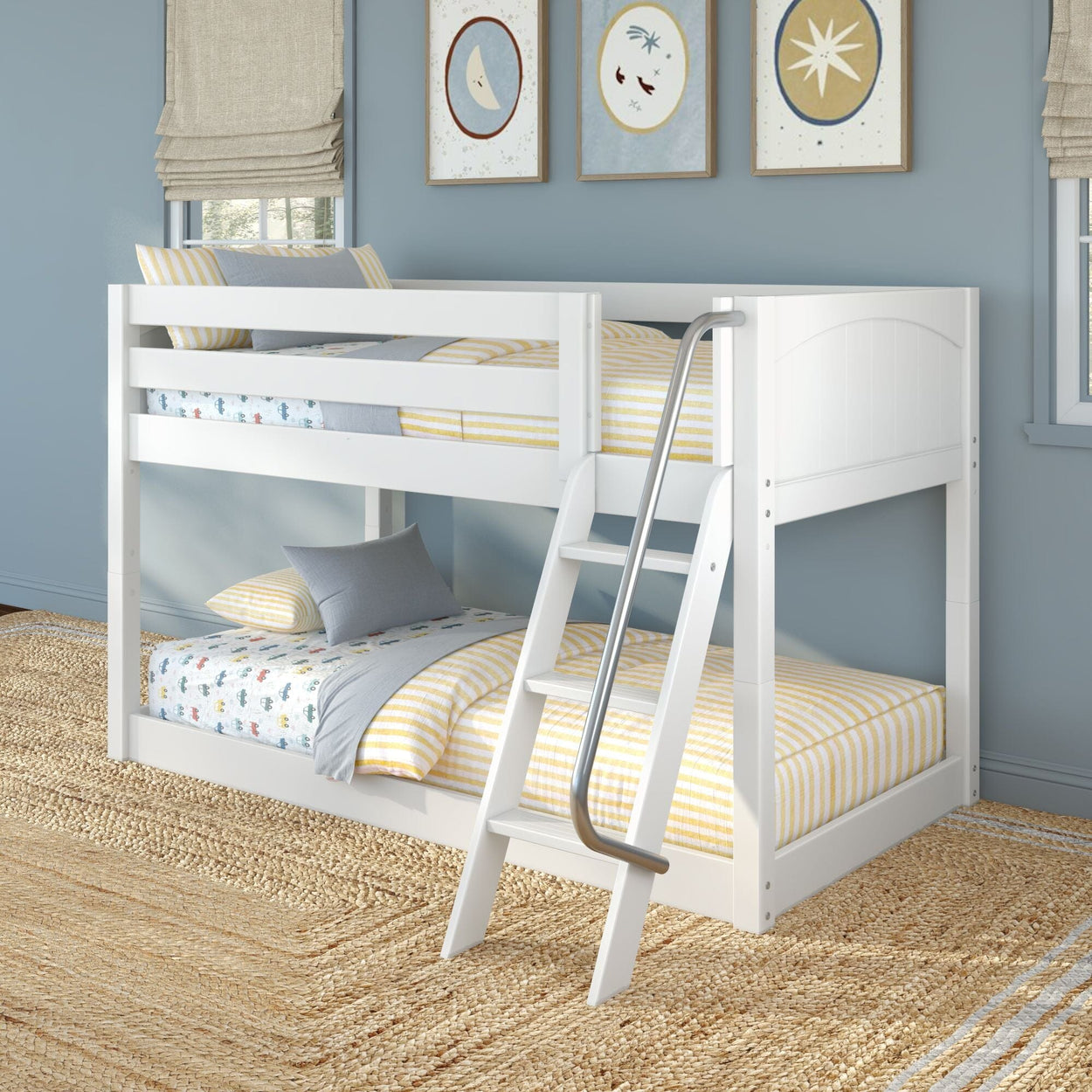 White wooden bunk bed with ladder in children's blue bedroom, yellow-striped bedding, playful wall art and natural jute rug