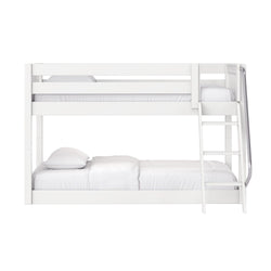 Modern white wooden bunk bed with ladder and safety guardrails, space-saving kids' bedroom solution with white mattress and pillows