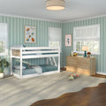 Children's bedroom with white bunk bed, teal striped wallpaper, wooden dresser, large windows with white roman shades, plush caterpillar on rug and framed insect art
