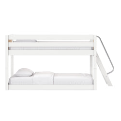 White modern wooden bunk bed with side ladder, stacked two-tier design, white mattress and pillows for minimalist bedroom décor