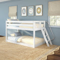 White kids bunk bed in a blue bedroom with yellow-striped bedding, beige Roman shades, framed celestial wall art and braided jute rug