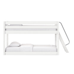 White wooden bunk bed with angled ladder and white bedding, modern minimalist frame with top and bottom bunks for kids' bedroom