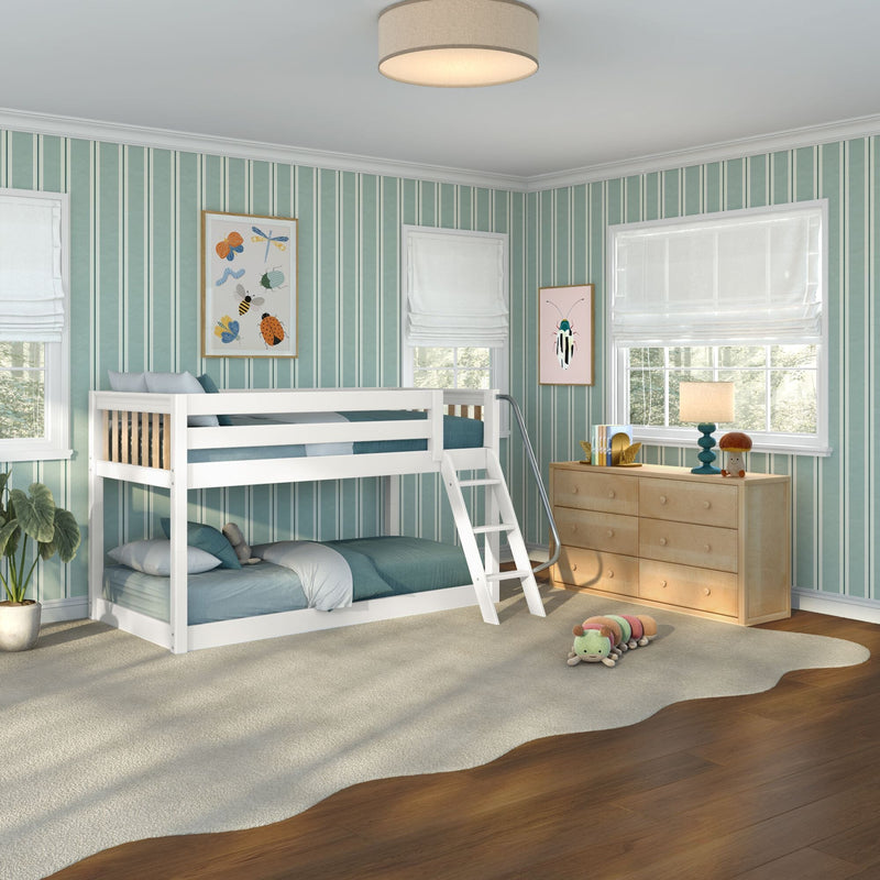 Kids' bedroom with white bunk bed, teal striped wallpaper, natural wood dresser, framed insect artwork, roman shades and plush caterpillar toy.