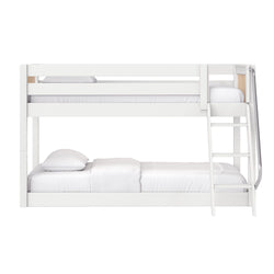White wooden twin-over-full bunk bed with ladder and safety guardrails, modern space-saving kids or guest bedroom setup with white bedding