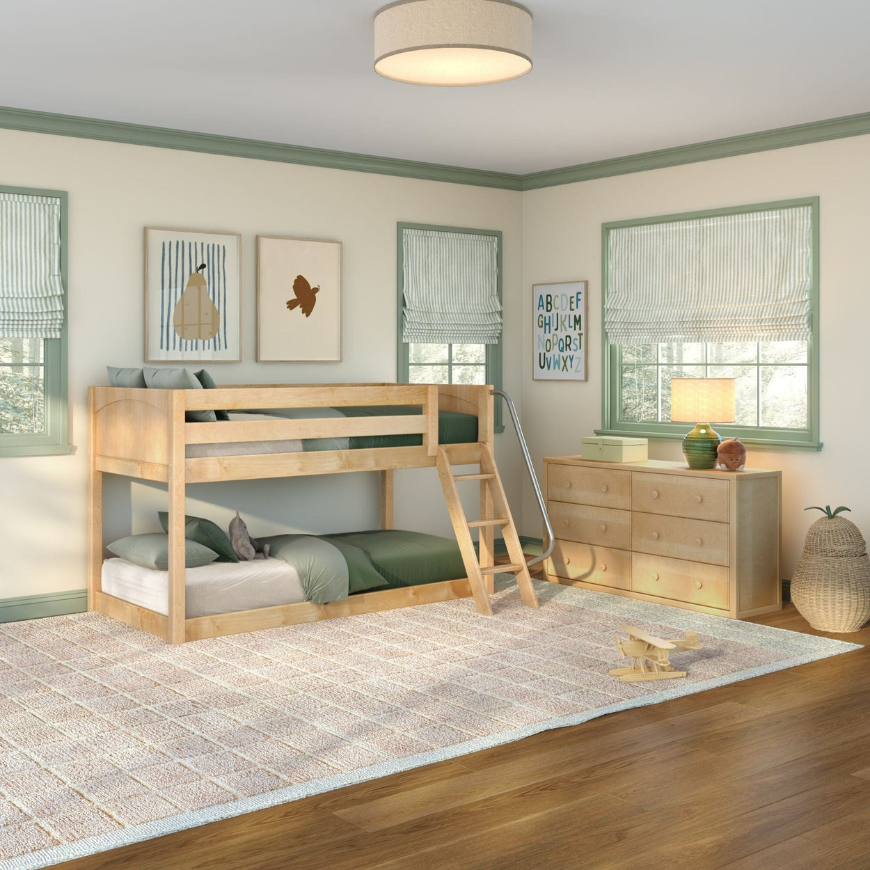 Light-wood twin-over-twin bunk bed in bright kids' bedroom with green trim, natural light, wooden dresser, soft rug, ladder and playful wall art