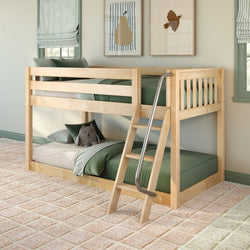 Natural wood twin-over-twin bunk bed with green bedding and metal-handled ladder in a bright children's bedroom featuring a plush owl toy, striped Roman shades, framed pear and bird prints, and a beige checkered carpet