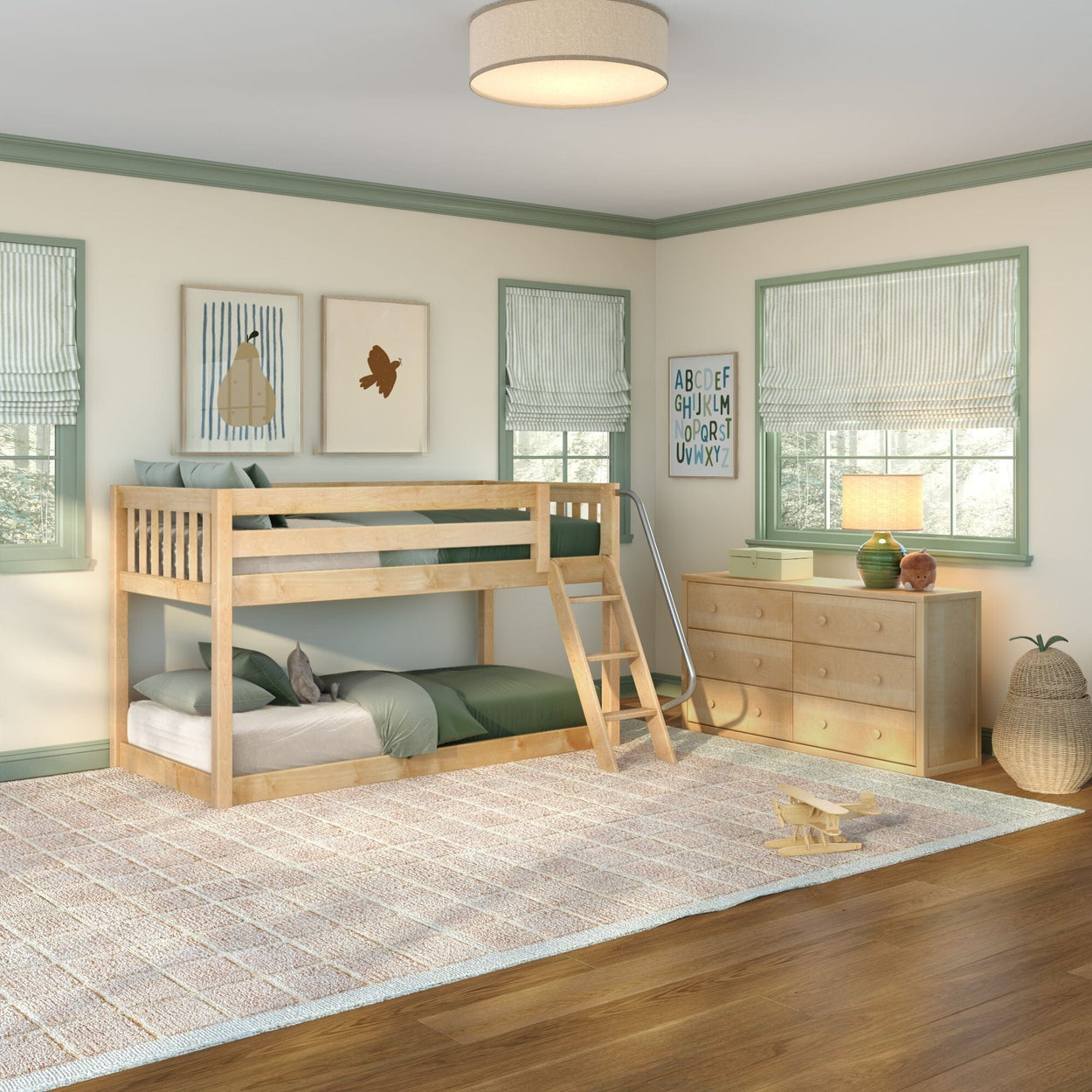 Natural wood bunk bed with ladder in bright kids' bedroom, green bedding, wooden dresser, striped roman shades and alphabet wall art