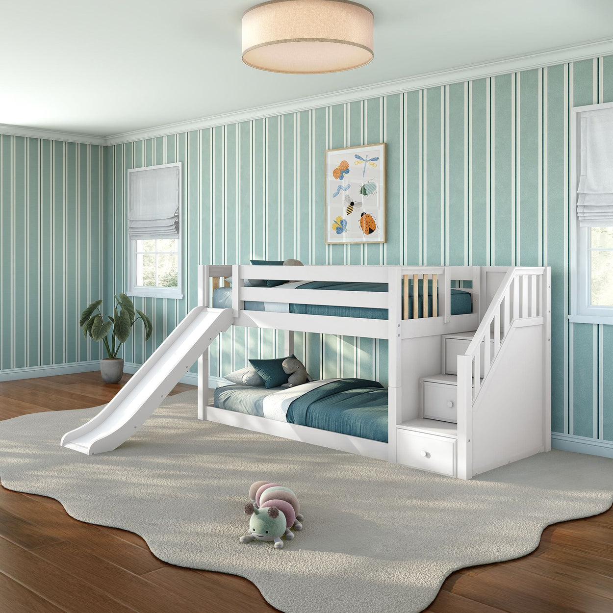 White wooden bunk bed with slide and built-in storage stairs in teal-striped children's bedroom with hardwood floors, plush rug and stuffed toy