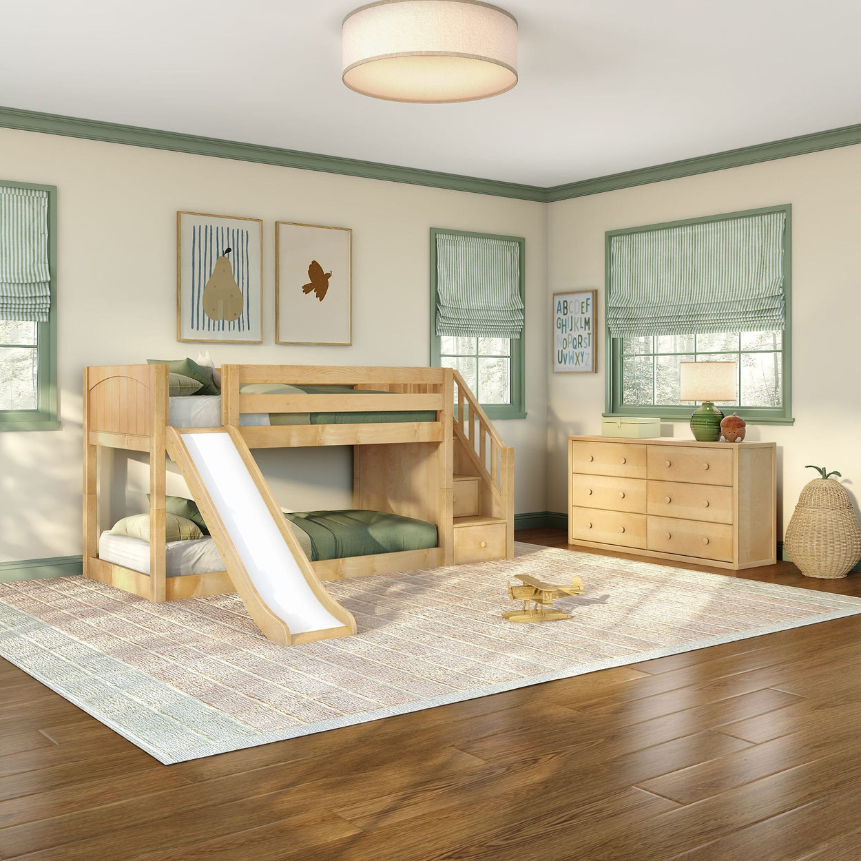 Natural wood children's bunk bed with slide and stairs in cozy green-accented kids' bedroom with dresser and hardwood floors