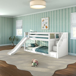 White wooden bunk bed with slide and built-in storage stairs in teal-striped kids' bedroom with plush rug and caterpillar toy