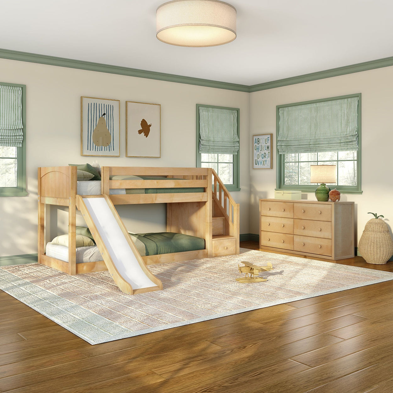 Modern children's bedroom featuring a natural wood bunk bed with slide and staircase storage, matching wood dresser, green-trim windows with Roman shades, light patterned rug and hardwood floors