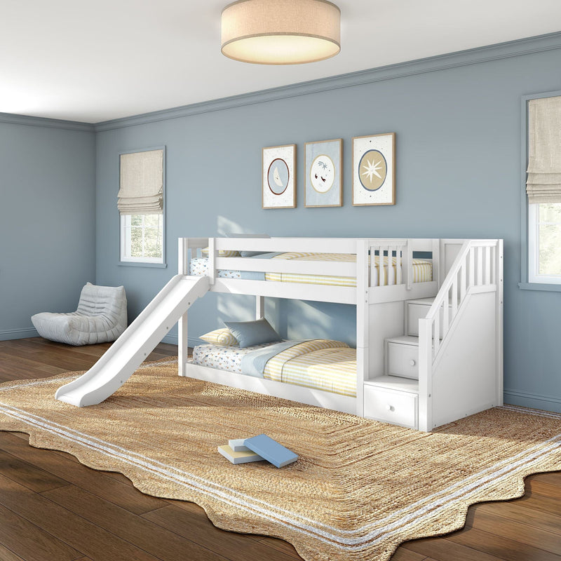 White bunk bed with slide in light-blue kids bedroom with nautical wall art, Roman shades, woven rug and soft ceiling light